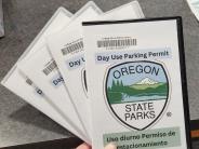 set of four parking passes to Oregon State Parks, fanned out so all are visible